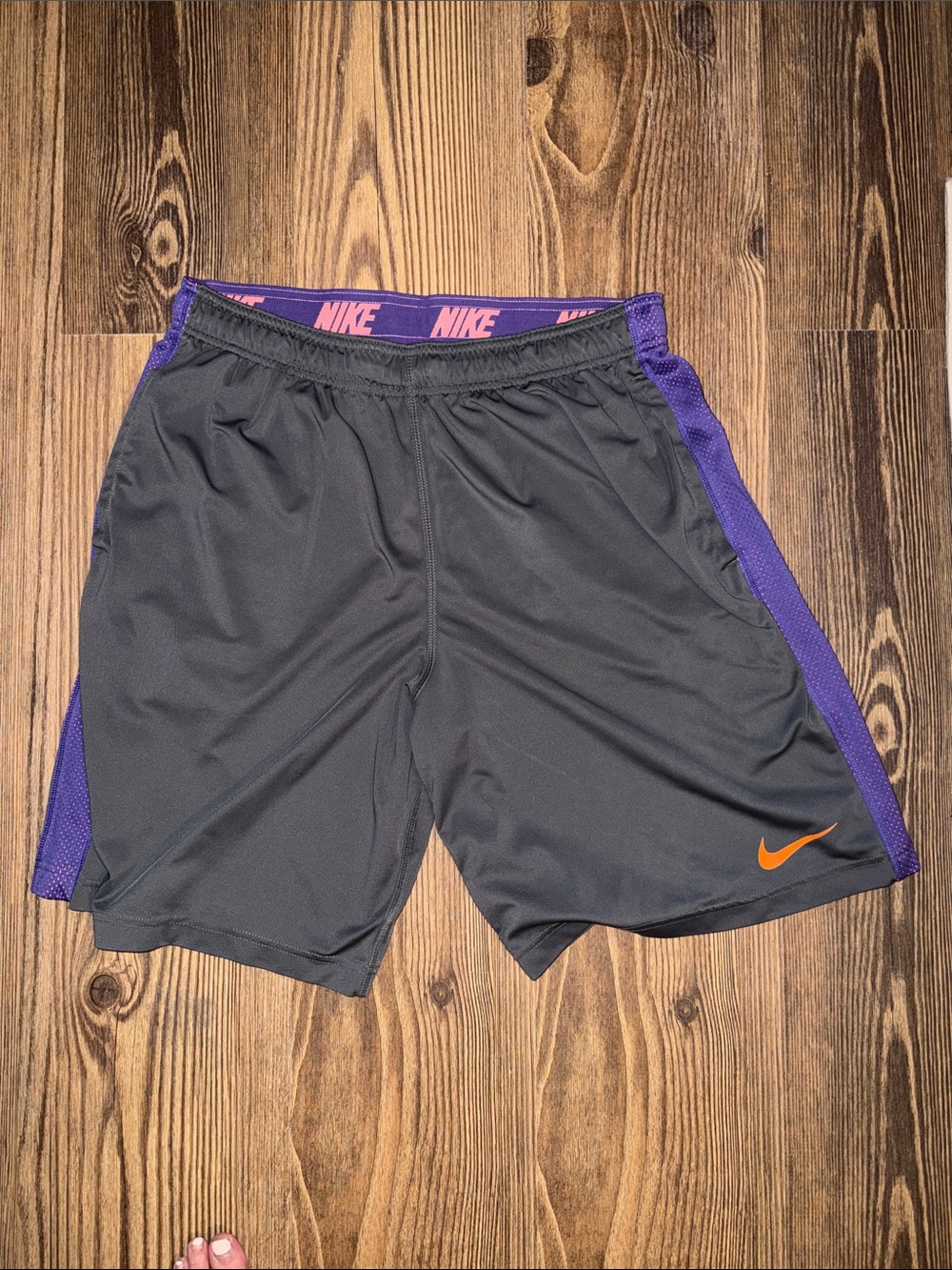 Nike Men's Black Athletic Shorts with Purple Panels and Orange Swoosh